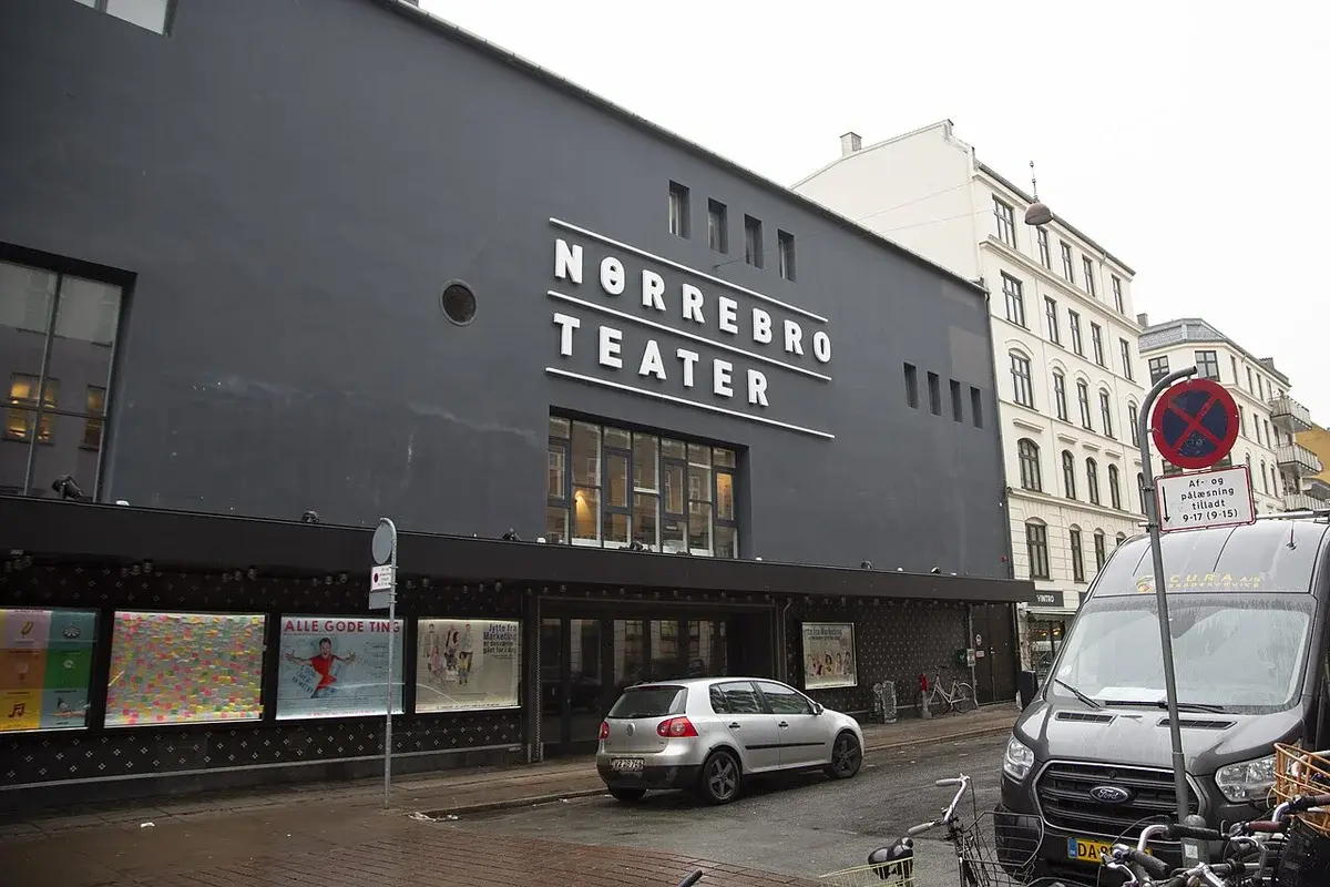 Exterior of Nørrebro Teater in Copenhagen on a city street.