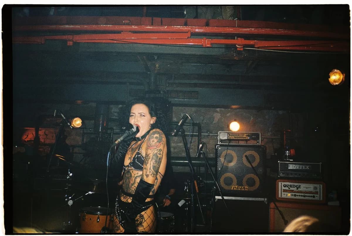 tattooed punk female singer performing on stage