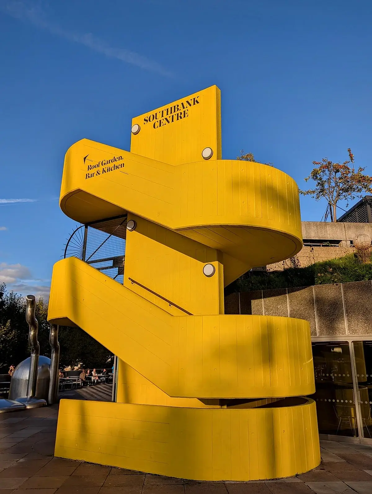 Bright yellow spiral staircase at the Southbank Centre in London.