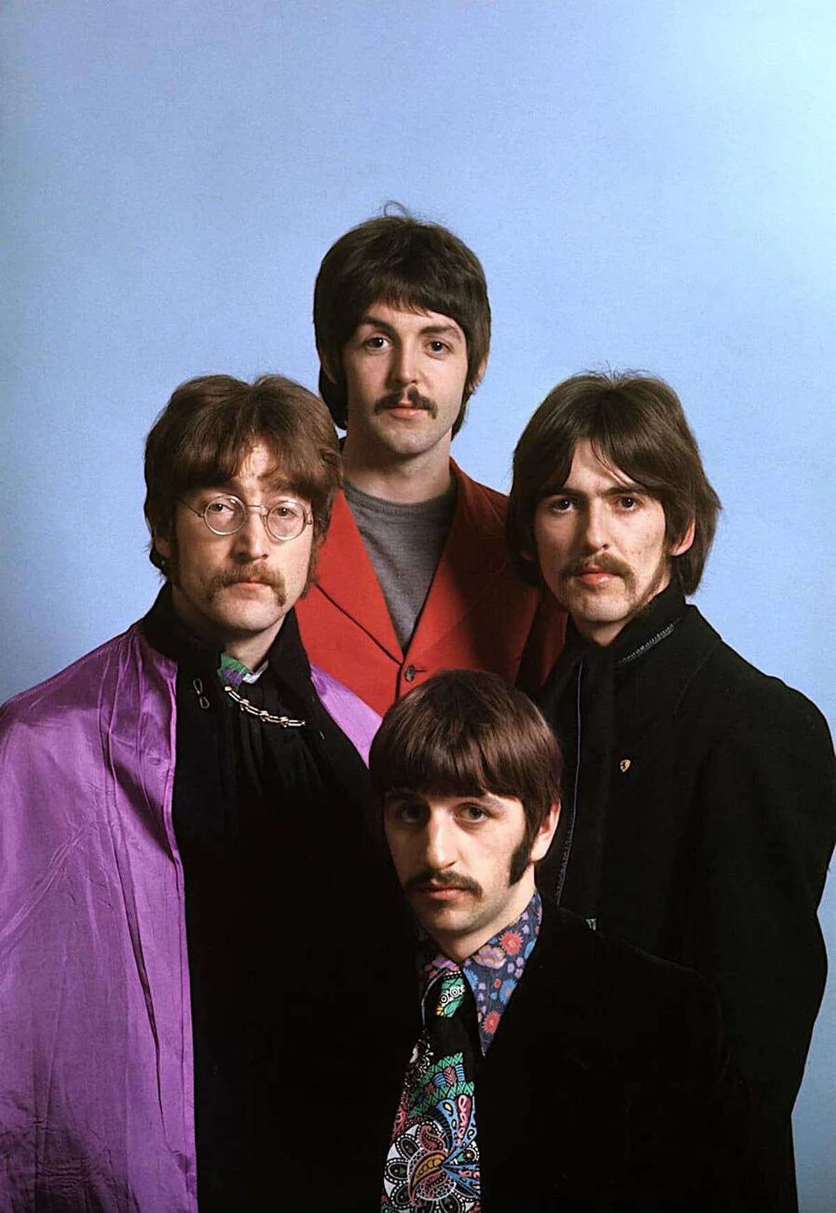 The Beatles promotional photo in 1967 with four members dressed in 1960s clothing