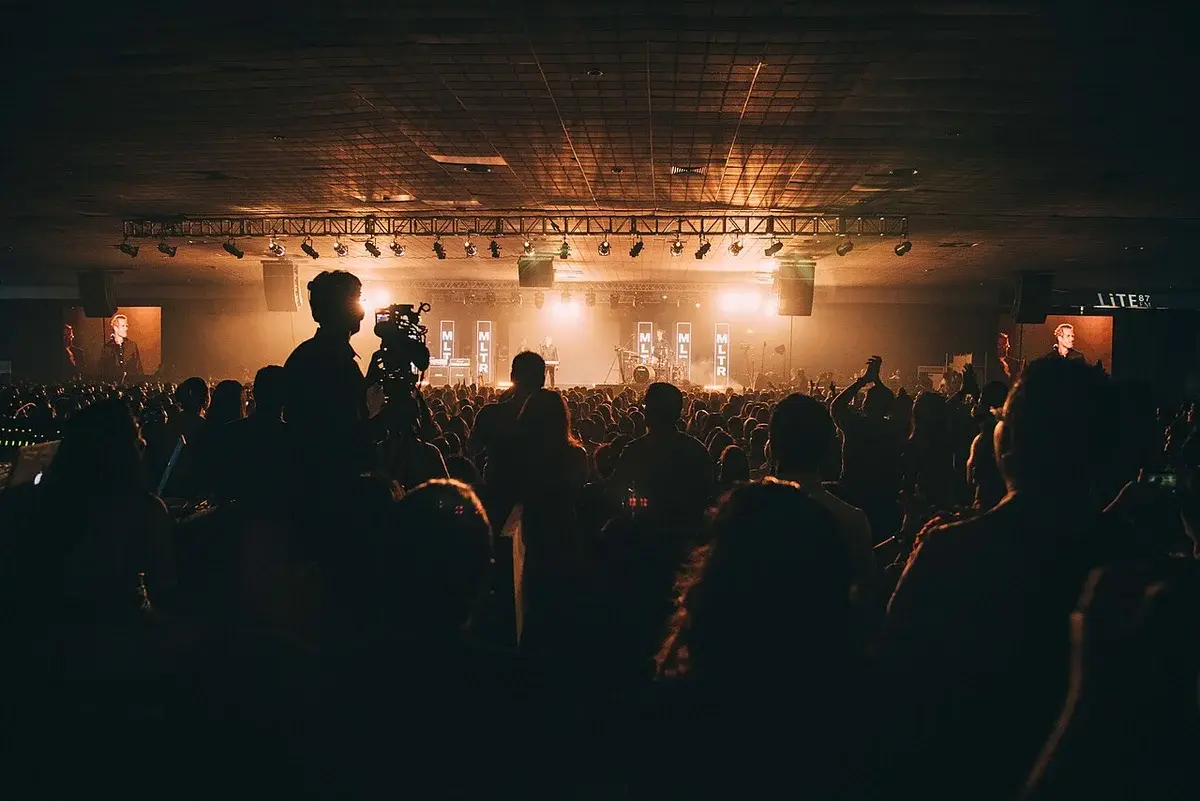 Michael Learns to Rock performing live on stage in front of a crowd.