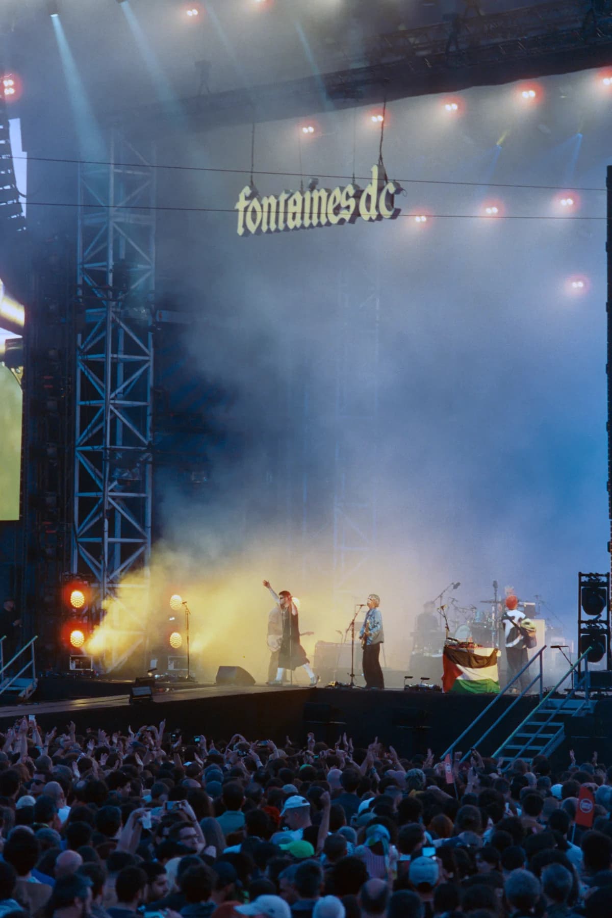 Fontaines D.C. performing onstage at Primavera Sound Porto with a large crowd below.