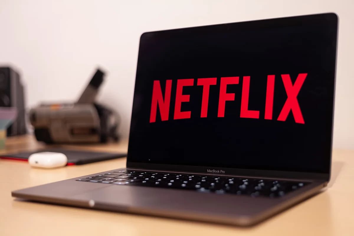 MacBook Pro laptop showing Netflix logo on screen