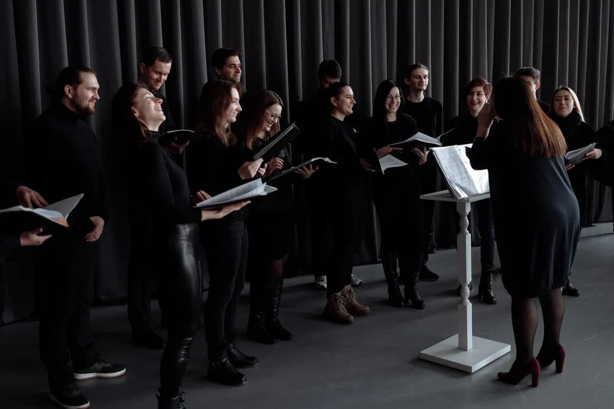 choir group rehearsing with a conductor