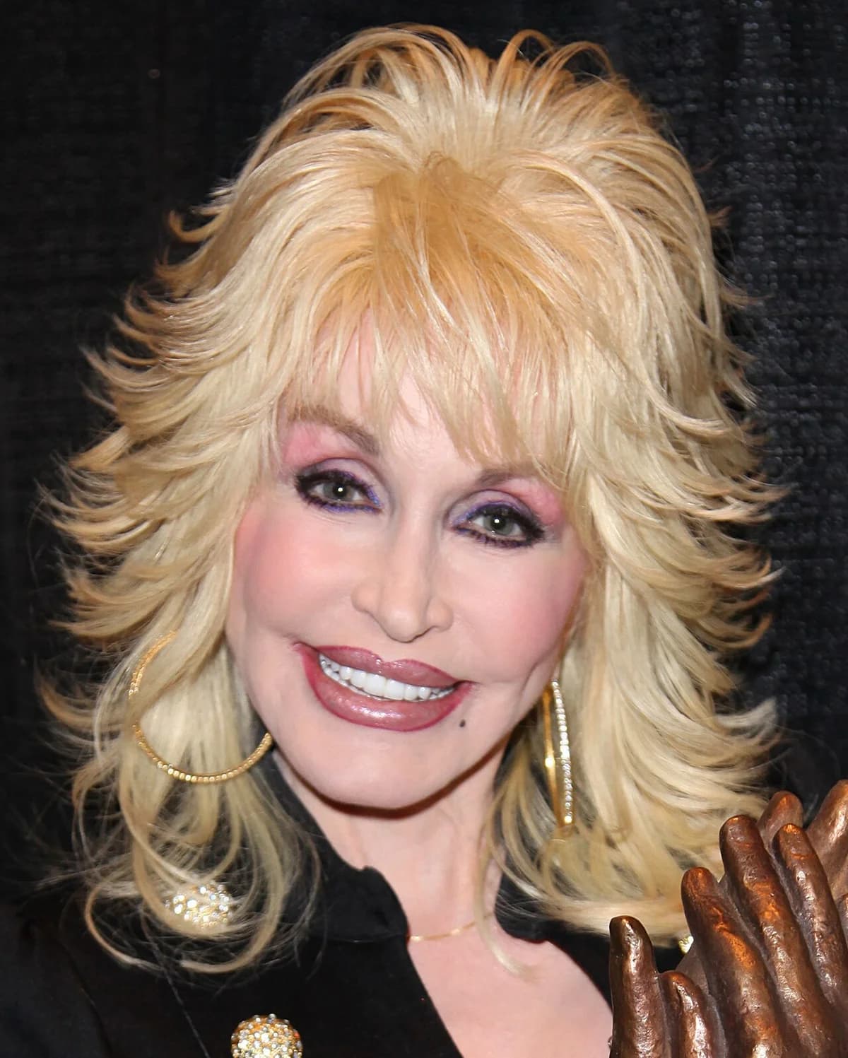 Close-up portrait of Dolly Parton smiling