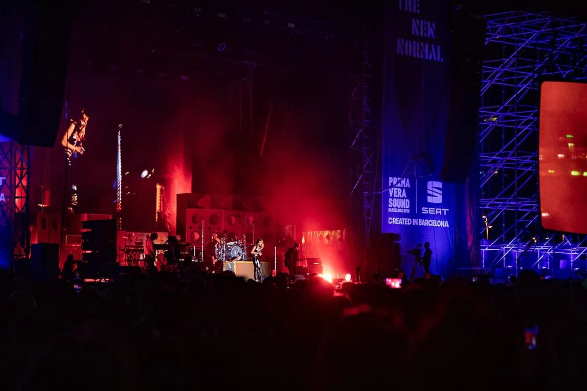 Miley Cyrus performing onstage at Primavera Sound 2019 under red and blue lights.