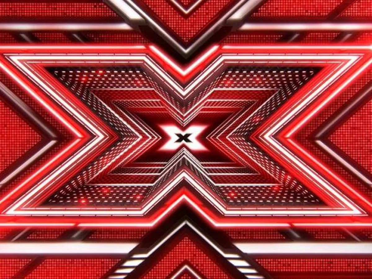 Red and white illuminated X Factor UK 2016 logo graphic