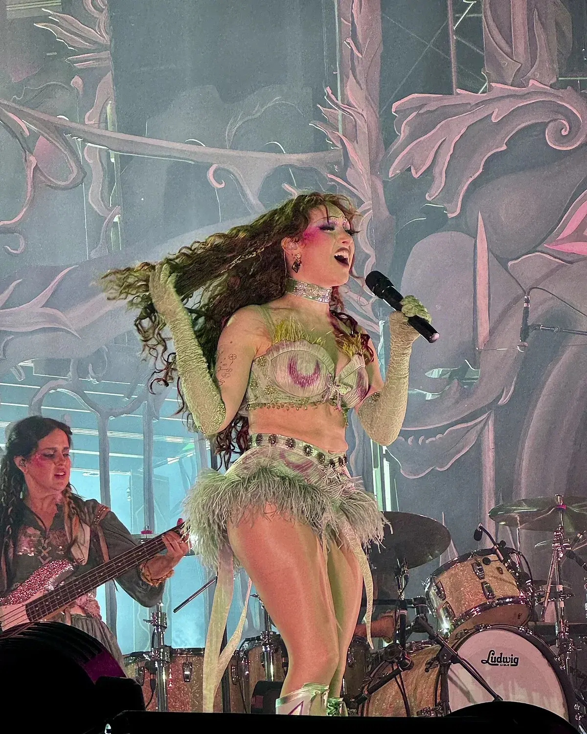 Chappell Roan singing on stage at a festival performance.