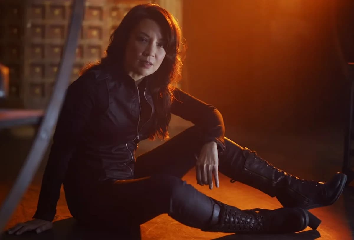 Ming-Na Wen seated on the floor in a dramatic trailer scene.
