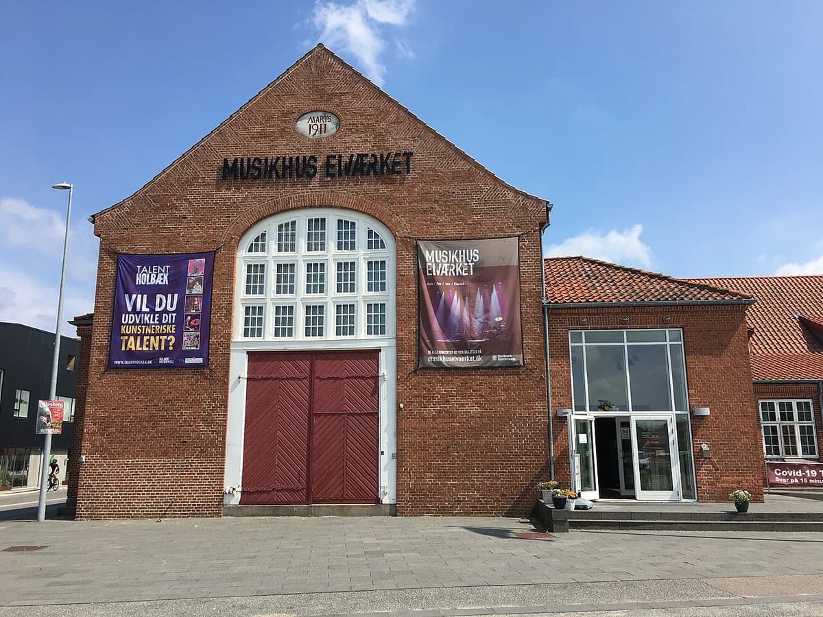 Brick building for Musikhuset Elværket with posters on the front.
