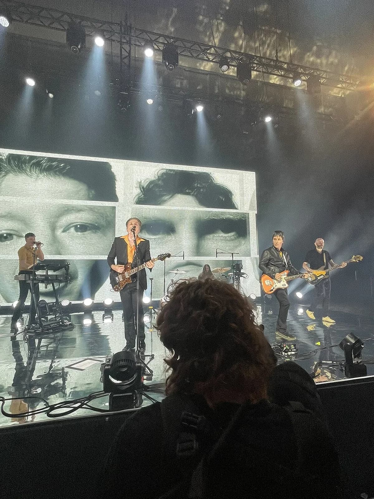 Franz Ferdinand performing live on stage with Johnny Marr at a livestream show in Manchester.