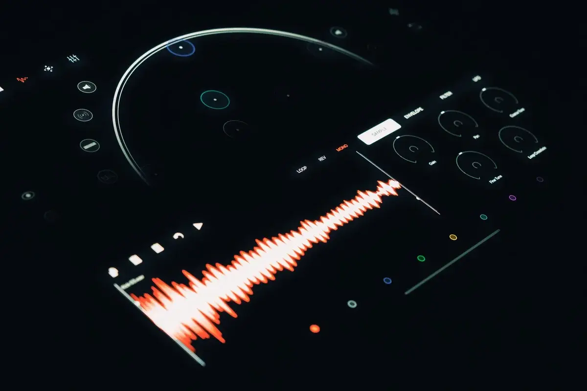 Close-up of a digital audio interface with a colorful sound waveform and glowing controls.